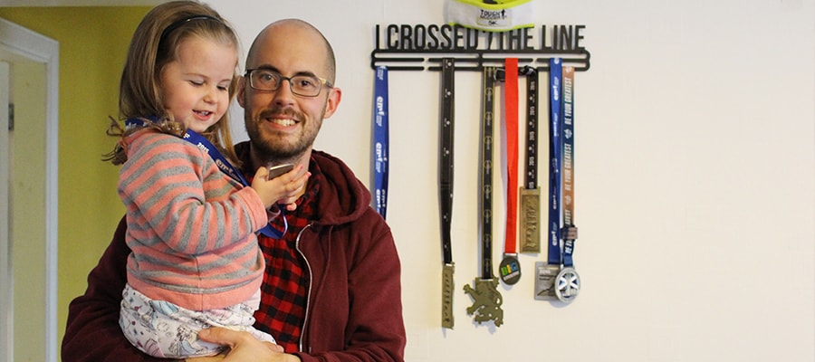 Calvin with his little daughter at their new home