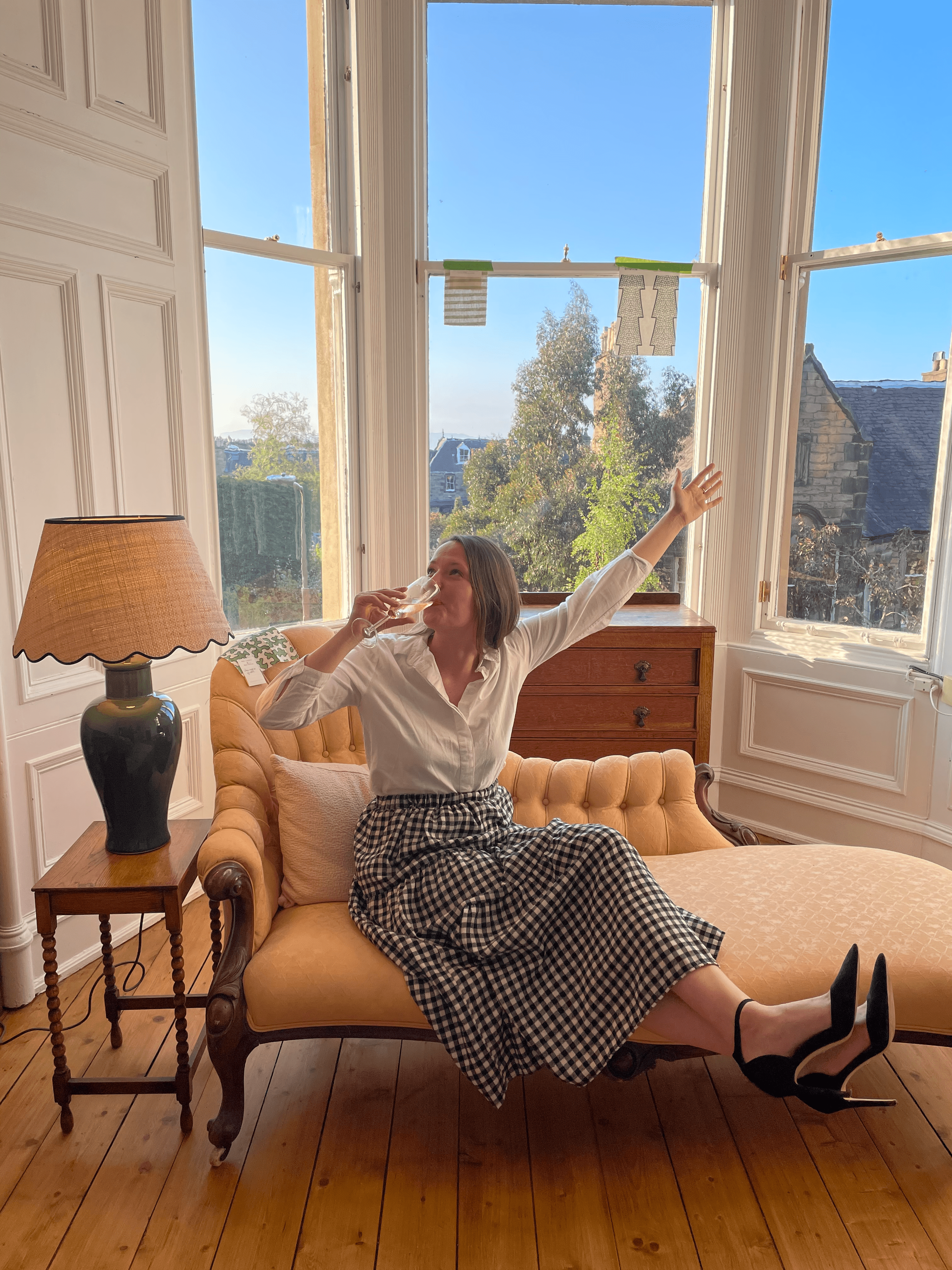 Woman drinking champagne on chaise longue