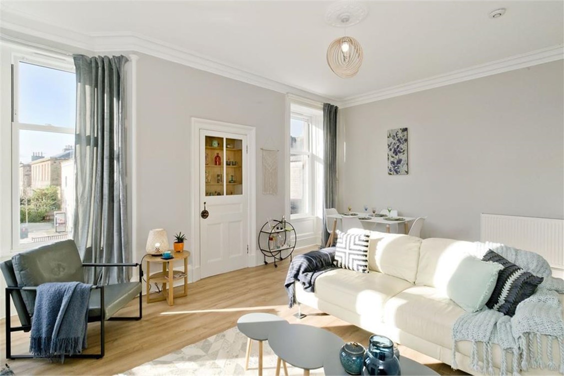 Living area with large windows in a home listed by ESPC